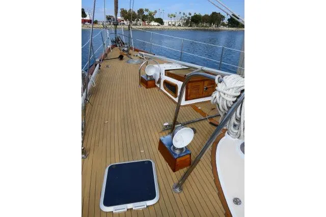 Slide: The Image of 1982 Ta Shing Mason 63 sailboat deck with rigging and winches. - 82