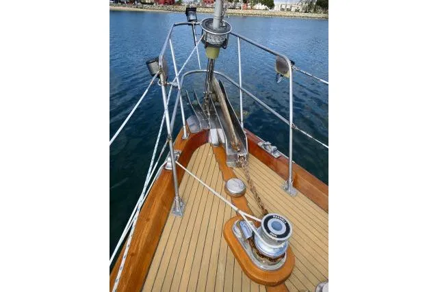 Slide: The Image of Bow of 1982 Ta Shing Mason 63 yacht with anchor and railing. - 85