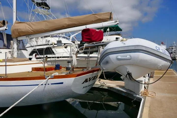 Slide: The Image of Inflatable boat with Yamaha motor docked near Ta Shing Mason 63 yacht, 1982 model. - 89