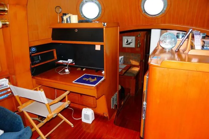 Slide: The Image of Interior of 1982 Ta Shing Mason 63 yacht with wooden furnishings and nautical decor. - 9