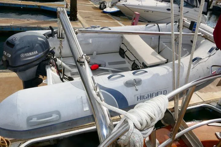 Slide: The Image of 1982 Ta Shing Mason 63 sailboat docked, featuring sleek bow design and nautical equipment. - 90