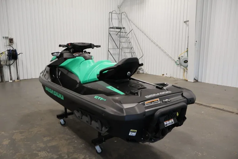 Slide: The Image of 2026 Sea-Doo GTI SE 130 jet ski in a garage setting. - 14
