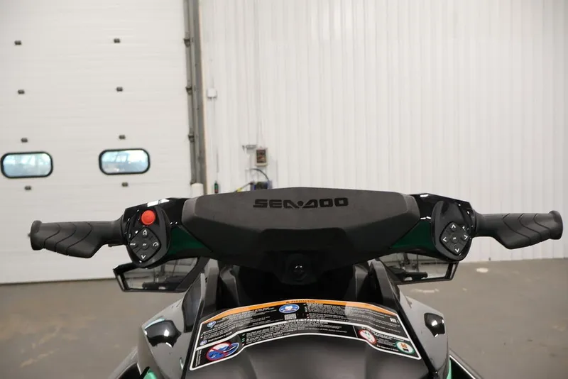 Slide: The Image of 2026 Sea-Doo GTI SE 130 handlebars in a garage setting. - 18