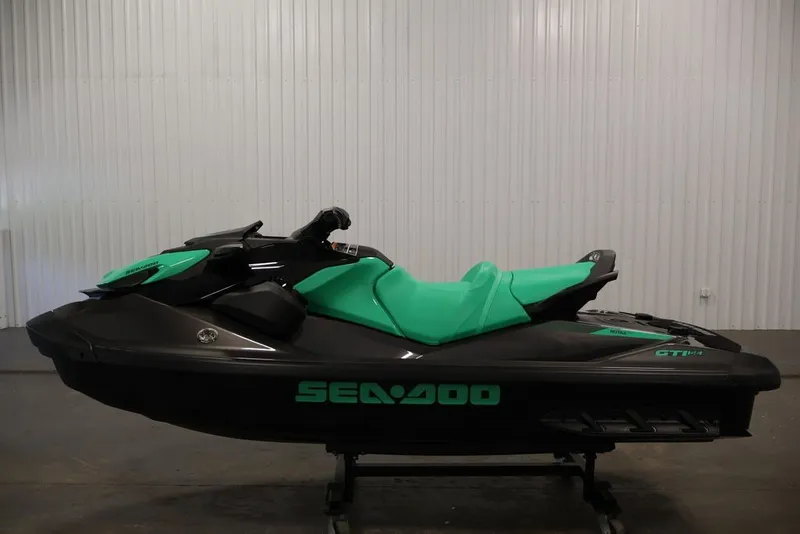 Slide: The Image of 2026 Sea-Doo GTI SE 130 jet ski in black and teal, side view. - 4