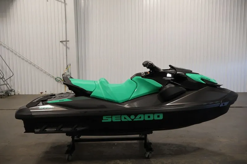 Slide: The Image of 2026 Sea-Doo GTI SE 130 jet ski in a garage setting. - 6