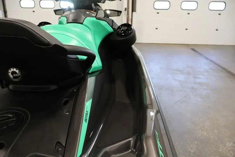 Slide: The Image of 2026 Sea-Doo GTI SE 130 jet ski in a garage, showcasing sleek design and seating. - 12