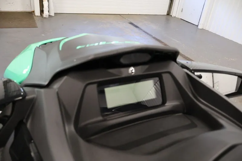 Slide: The Image of 2026 Sea-Doo GTI SE 130 dashboard and display in a garage setting. - 13