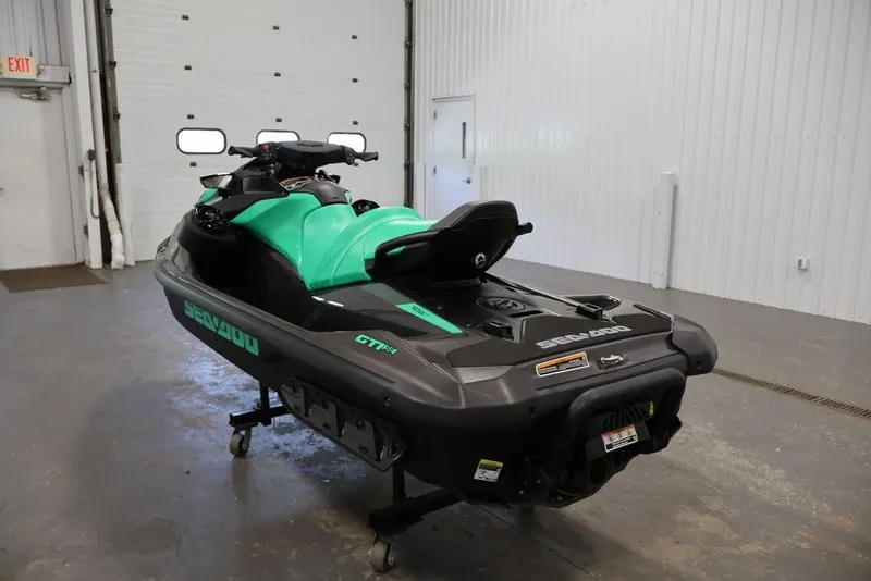 Slide: The Image of 2026 Sea-Doo GTI SE 130 jet ski in a garage setting. - 17