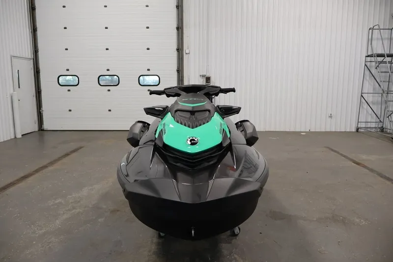 Slide: The Image of 2026 Sea-Doo GTI SE 130 jet ski in a garage setting. - 7
