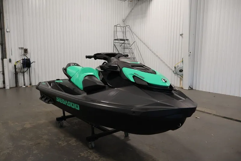Slide: The Image of 2026 Sea-Doo GTI SE 130 jet ski in a garage setting. - 3