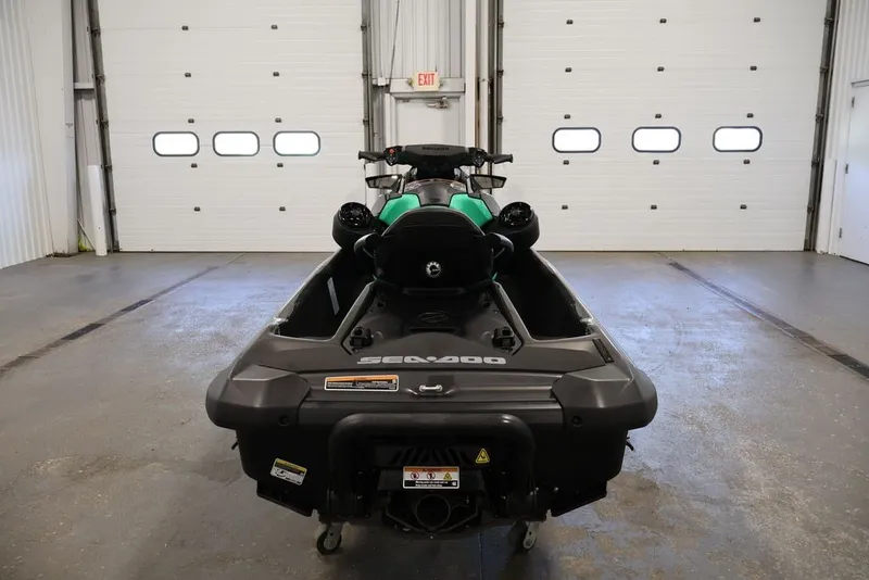 Slide: The Image of 2026 Sea-Doo GTI SE 130 jet ski in a garage, rear view. - 17