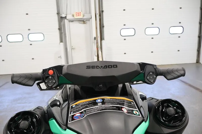 Slide: The Image of 2026 Sea-Doo GTI SE 130 handlebars in a garage setting. - 18