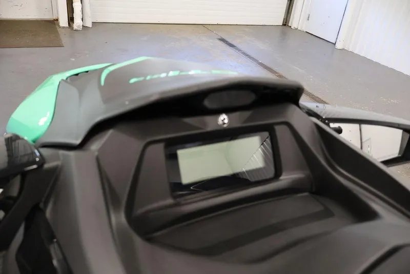 Slide: The Image of 2026 Sea-Doo GTI SE 130 dashboard in a garage setting. - 13