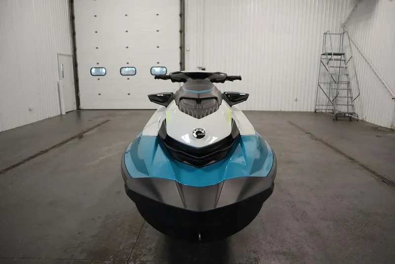 Slide: The Image of 2026 Sea-Doo GTI SE 130 jet ski in a spacious indoor setting. - 12