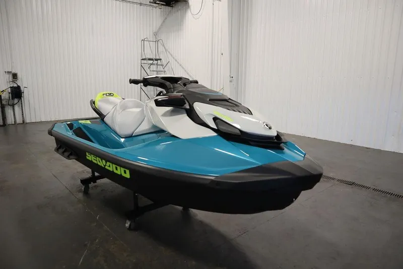 Slide: The Image of 2026 Sea-Doo GTI SE 130 jet ski in a showroom, featuring sleek design and vibrant colors. - 13