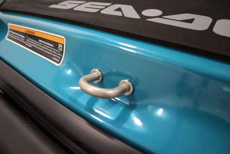 Slide: The Image of 2026 Sea-Doo GTI SE 130, close-up of blue body with handle and warning label. - 16