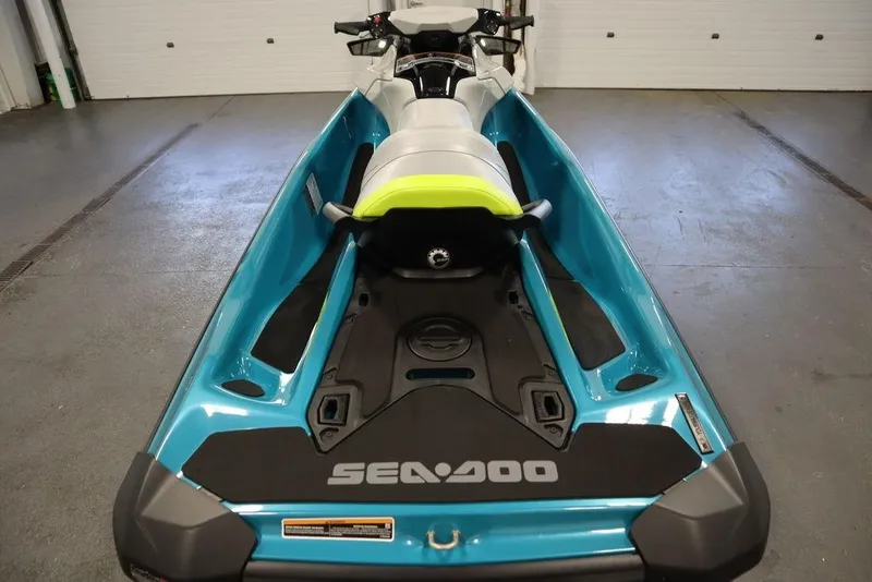 Slide: The Image of 2026 Sea-Doo GTI SE 130 jet ski in a garage, showcasing sleek design and vibrant colors. - 17