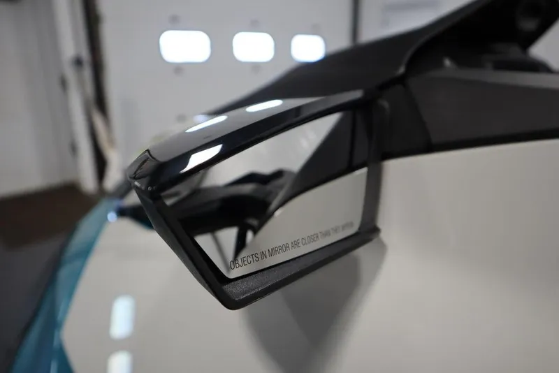 Slide: The Image of Close-up of 2026 Sea-Doo GTI SE 130 side mirror with safety warning text. - 19