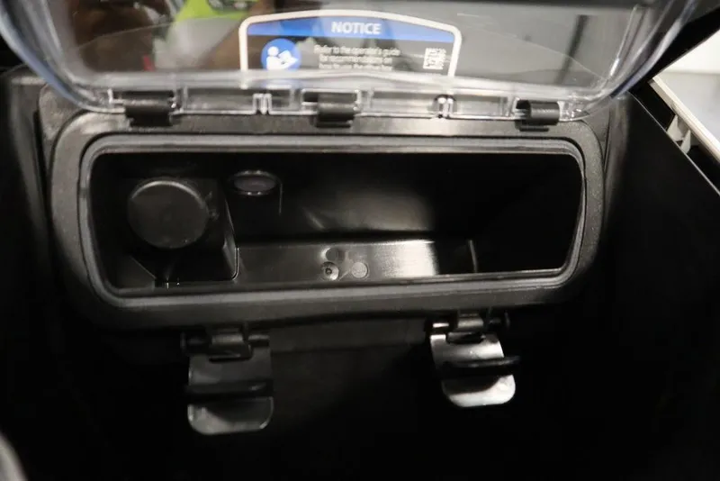 Slide: The Image of Storage compartment of 2026 Sea-Doo GTI SE 130, featuring secure latches and a clear lid. - 22