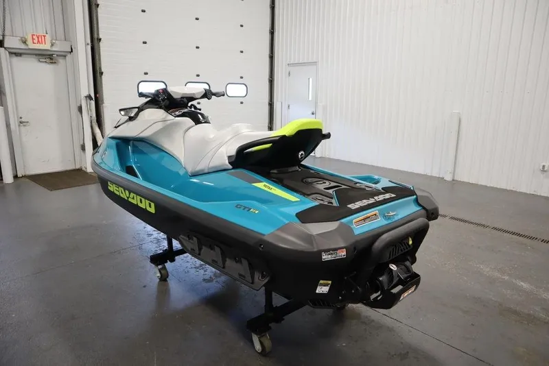 Slide: The Image of 2026 Sea-Doo GTI SE 130 jet ski in a garage, showcasing sleek design and vibrant colors. - 8