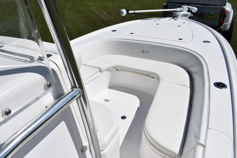 Slide: The Image of 2018 Contender 25 Bay boat interior with white seating and stainless steel railing. - 13