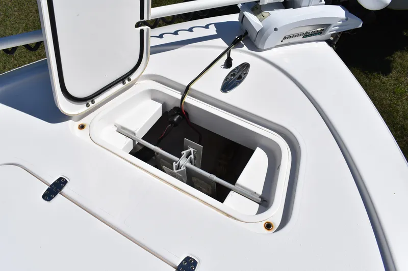 Slide: The Image of 2018 Contender 25 Bay boat anchor compartment with open hatch and wiring. - 16