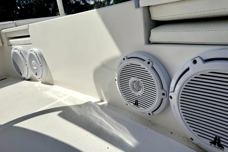 Slide: The Image of White JL Audio speakers on 2018 Contender 25 Bay boat interior. - 17