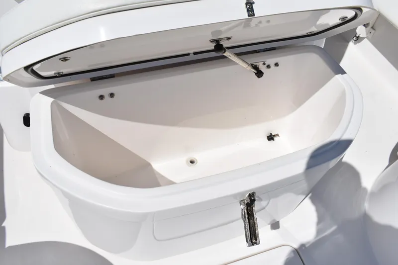 Slide: The Image of Open storage compartment on a 2018 Contender 25 Bay boat, showcasing interior space. - 21