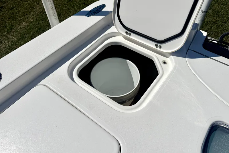 Slide: The Image of Open storage compartment on 2018 Contender 25 Bay boat deck. - 22