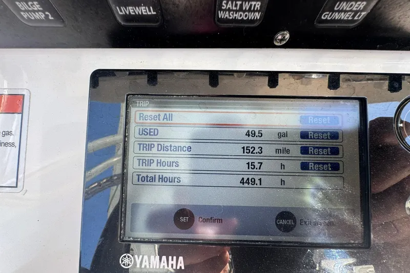 Slide: The Image of Yamaha boat display showing trip data: 49.5 gallons used, 152.3 miles, 15.7 hours. - 25