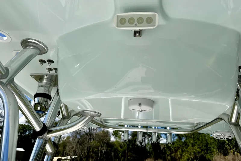 Slide: The Image of 2018 Contender 25 Bay boat's underside view, showcasing metal framework and lighting. - 28