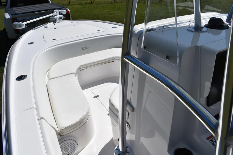 Slide: The Image of 2018 Contender 25 Bay boat interior with white seating and sleek design. - 9