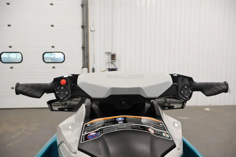 Slide: The Image of 2026 Sea-Doo GTI SE 170 handlebars in a garage setting. - 12