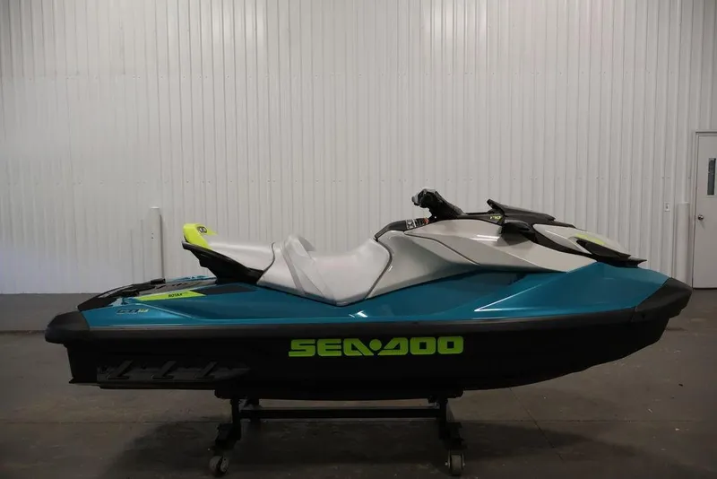 Slide: The Image of 2026 Sea-Doo GTI SE 170 jet ski in a showroom, featuring sleek design and vibrant colors. - 16