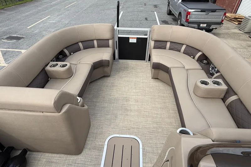 Slide: The Image of 2019 Bennington 23 SX Entertainment pontoon boat with spacious seating and cup holders. - 11