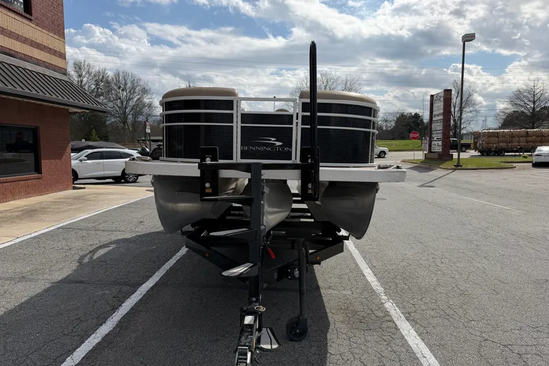Slide: The Image of 2019 Bennington 23 SX Entertainment pontoon boat on trailer in parking lot. - 3