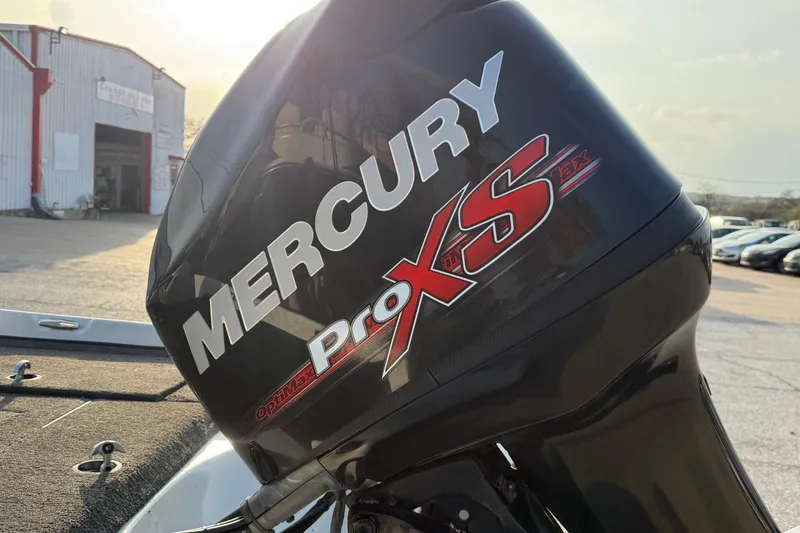 Slide: The Image of Mercury Pro XS outboard motor on 2015 Nitro Z-6 boat, outdoor setting. - 13