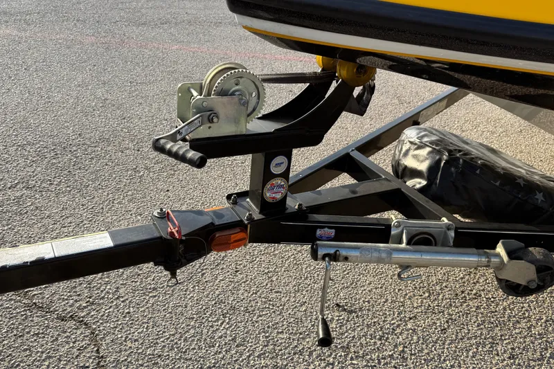 Slide: The Image of Trailer hitch and winch of a 2015 Nitro Z-6 boat on asphalt. - 16