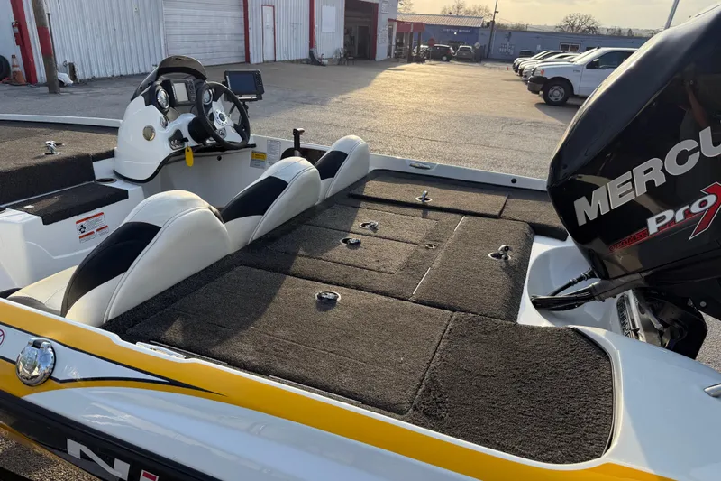 Slide: The Image of 2015 Nitro Z-6 boat with Mercury Pro motor, featuring spacious deck and modern controls. - 26