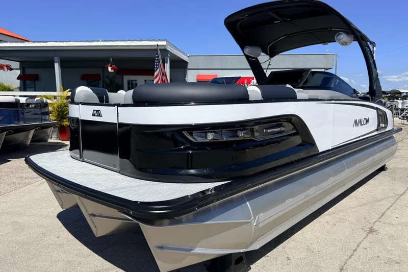 The Image of 2026 Avalon 2585 Excalibur LTD Tri Toon boat with sleek design and high performance features. - 1