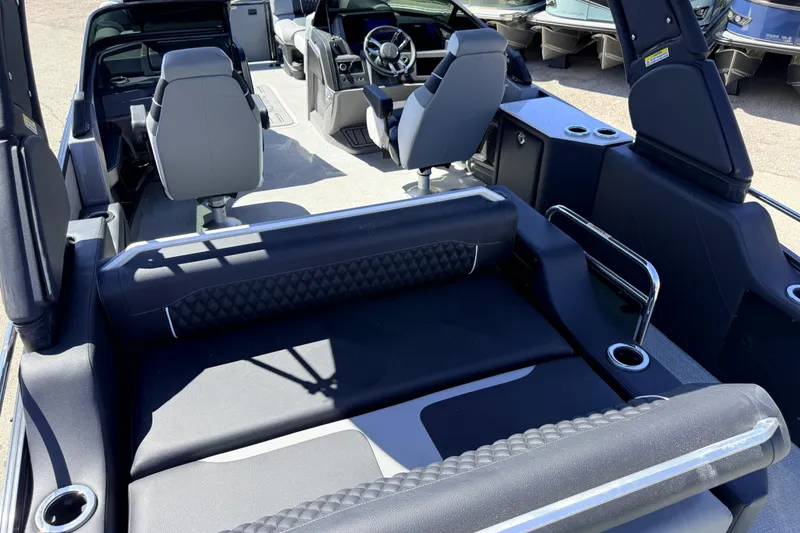 Slide: The Image of 2026 Avalon 2585 Excalibur LTD boat interior with modern seating and steering wheel. - 12