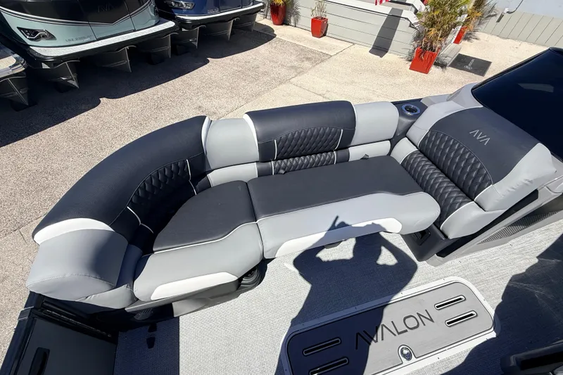 Slide: The Image of 2026 Avalon 2585 Excalibur LTD boat with luxurious gray and black seating. - 15