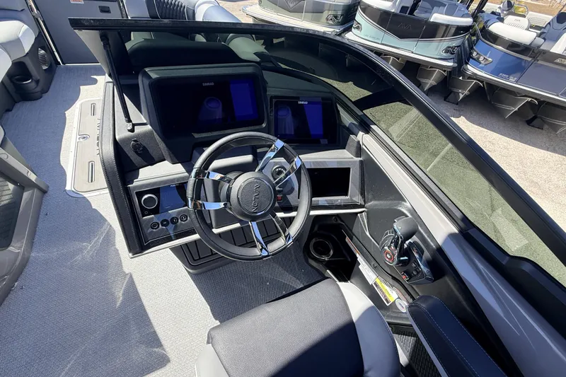 Slide: The Image of 2026 Avalon 2585 Excalibur LTD boat dashboard with steering wheel and control panel. - 24