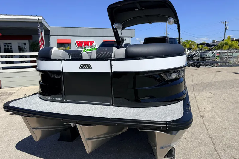 Slide: The Image of 2026 Avalon 2585 Excalibur LTD Tri Toon boat, high performance, parked outdoors. - 3