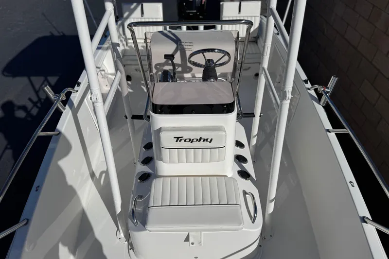 Slide: The Image of 2022 Trophy T18 boat interior with steering console and seating. - 11