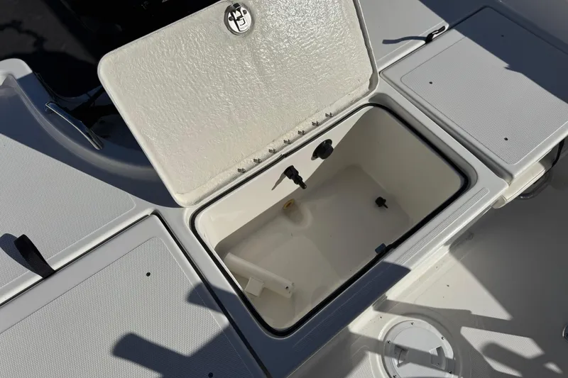 Slide: The Image of Open storage compartment on 2022 Trophy T18 boat deck. - 21