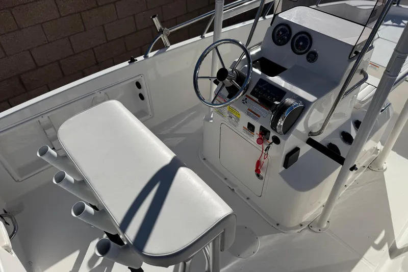 Slide: The Image of 2022 Trophy T18 boat cockpit with steering wheel and control panel. - 22