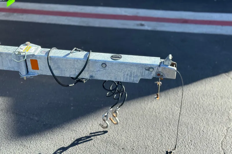 Slide: The Image of Trailer hitch of a 2022 Trophy T18 on asphalt background. - 27