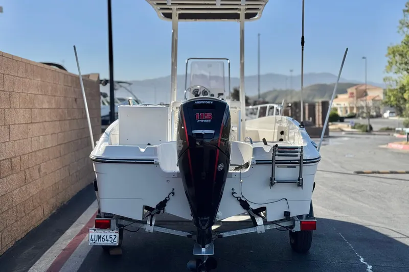 Slide: The Image of 2022 Trophy T18 boat with Mercury 115 engine, parked on a trailer. - 4