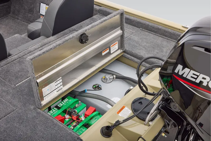 Slide: The Image of 2026 Tracker Pro Team 175 TXW Tournament Edition boat interior with engine and battery compartment. - 7